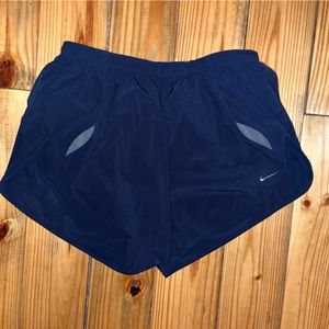 Blue Nike running shorts with gray lining